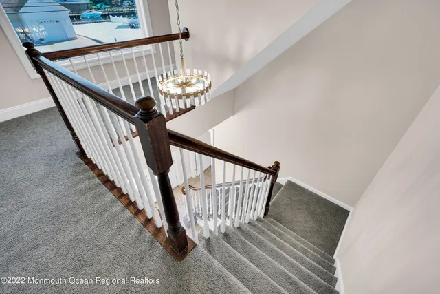 a front view of a house with a garden and plants