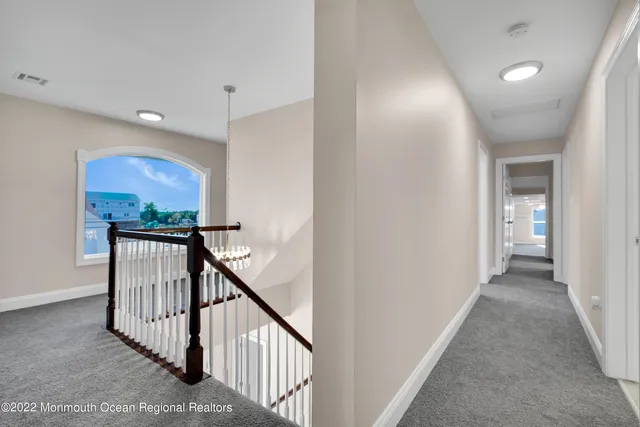 a view of a swimming pool and trees in the background