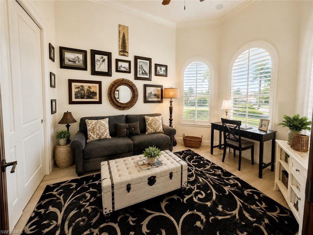 6574 Amarone Lane Naples, FL 34113 - Photo 17 of 44 a living room with furniture and a large window