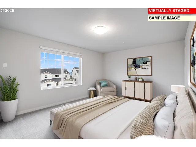 a bedroom with a large bed and a large window