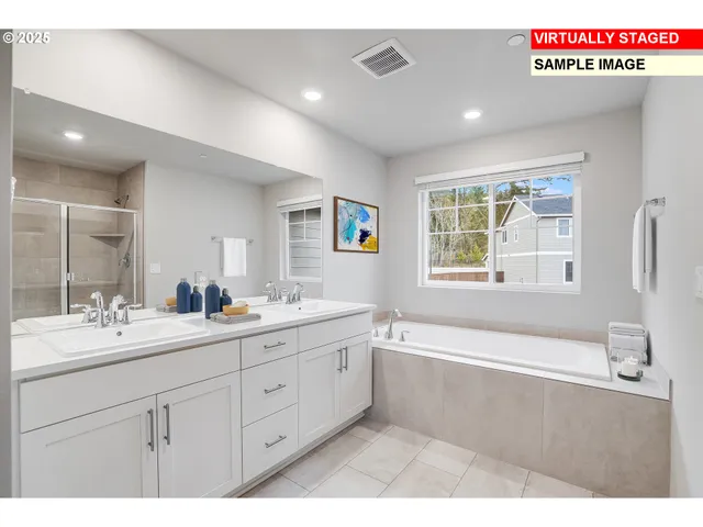 a spacious bathroom with a granite countertop sink mirror and bathtub