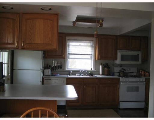 Kitchen. Kitchen view from dining area.  Very spacious feeling with only counter area separating the two.