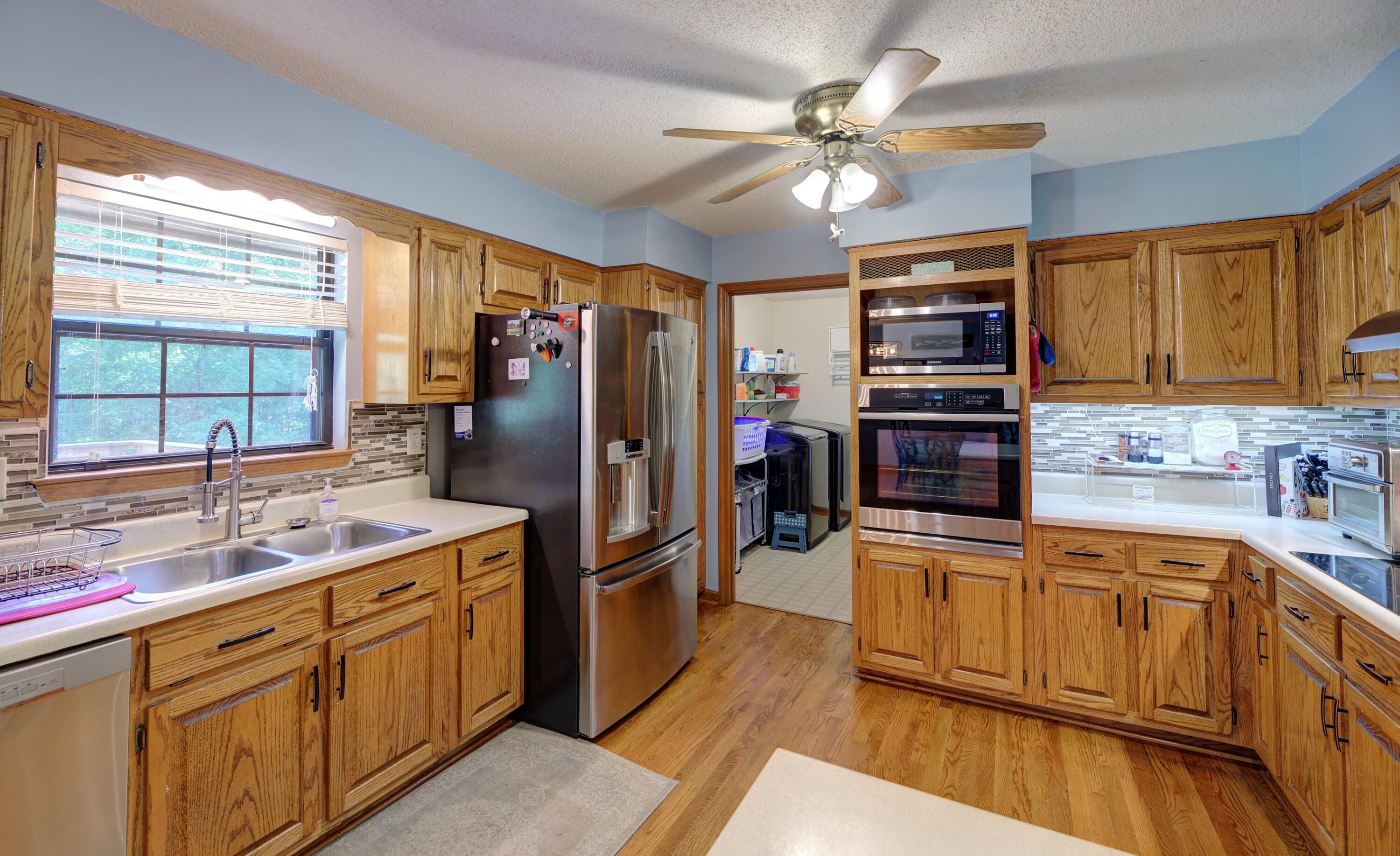 8741 East Ridge Trail Road Soddy Daisy, TN 37379 - Photo 8 of 34 Kitchen and Laundry room