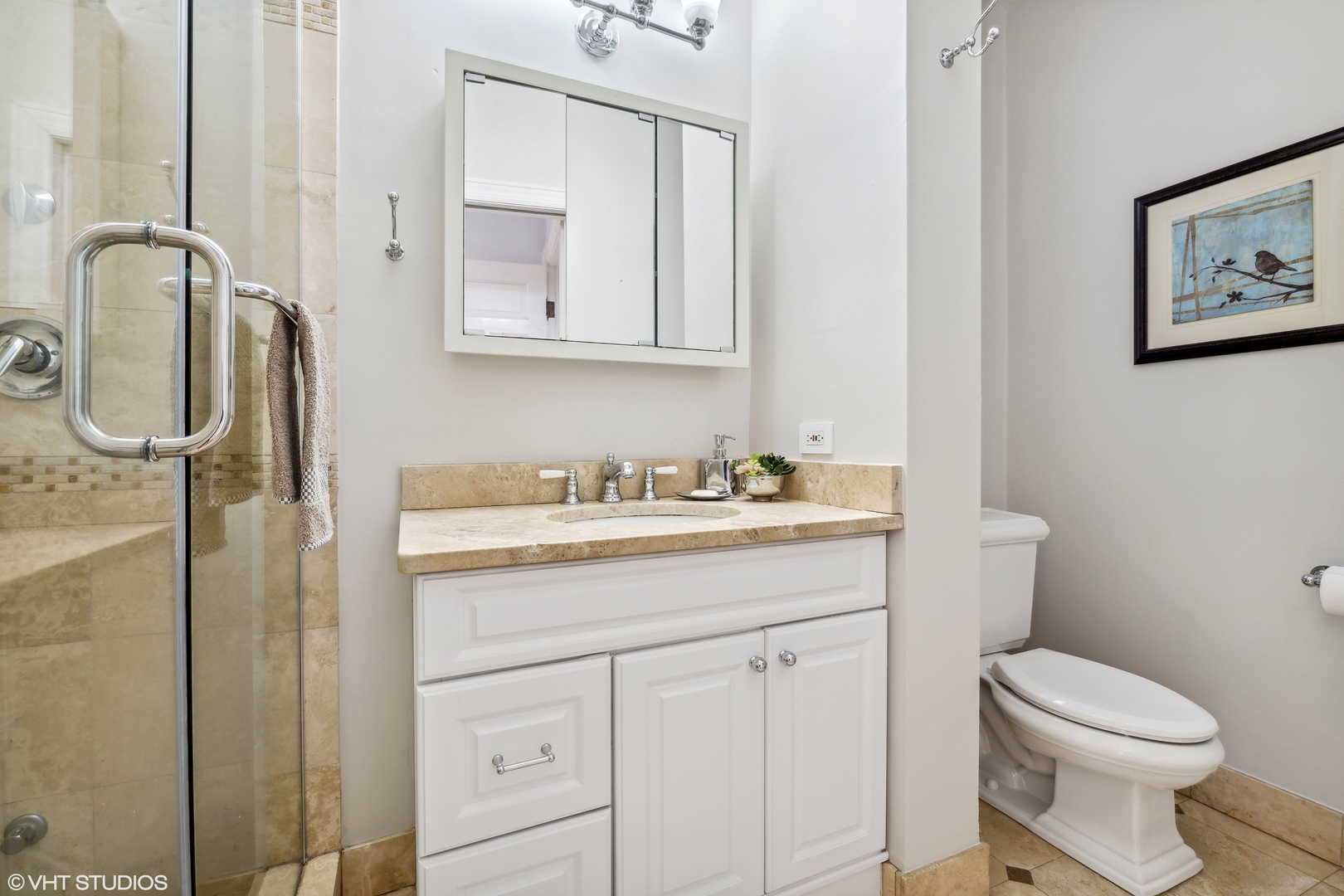 626 West Belden Avenue, Unit 2 Chicago, IL 60614 - Photo 15 of 17 a bathroom with a granite countertop sink vanity mirror and toilet