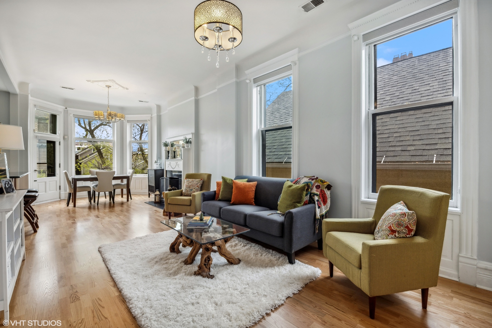 626 West Belden Avenue, Unit 2 Chicago, IL 60614 - Photo 4 of 17 a living room with furniture wooden floor and a large window