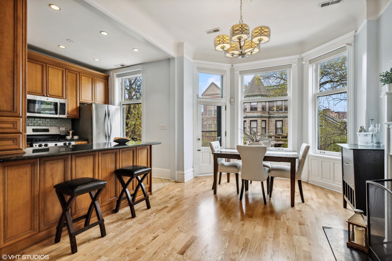 626 West Belden Avenue, Unit 2 Chicago, IL 60614 - Photo 7 of 17 a view of a dining room with furniture window and wooden floor