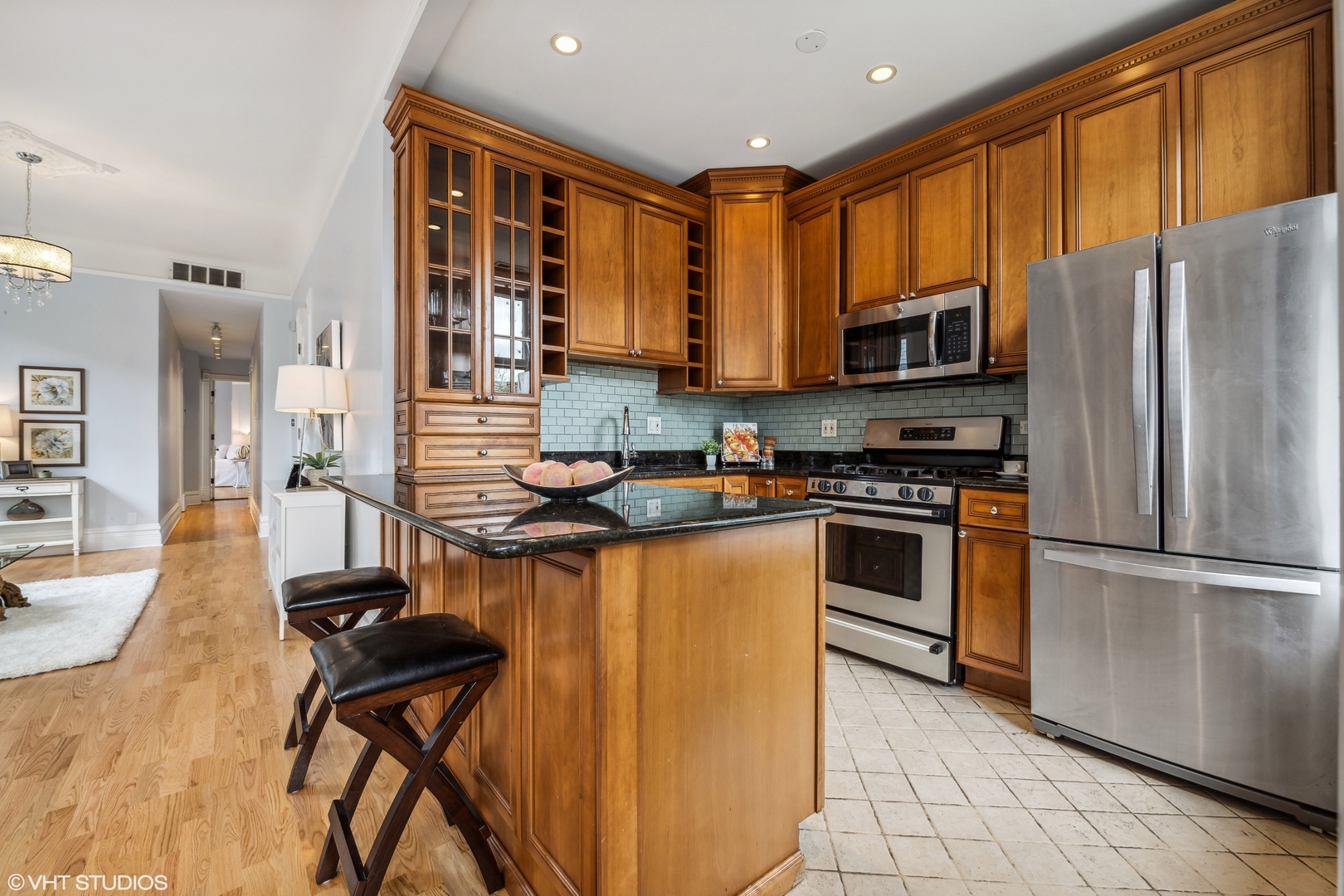 626 West Belden Avenue, Unit 2 Chicago, IL 60614 - Photo 8 of 17 a kitchen with stainless steel appliances granite countertop a stove refrigerator sink and cabinets