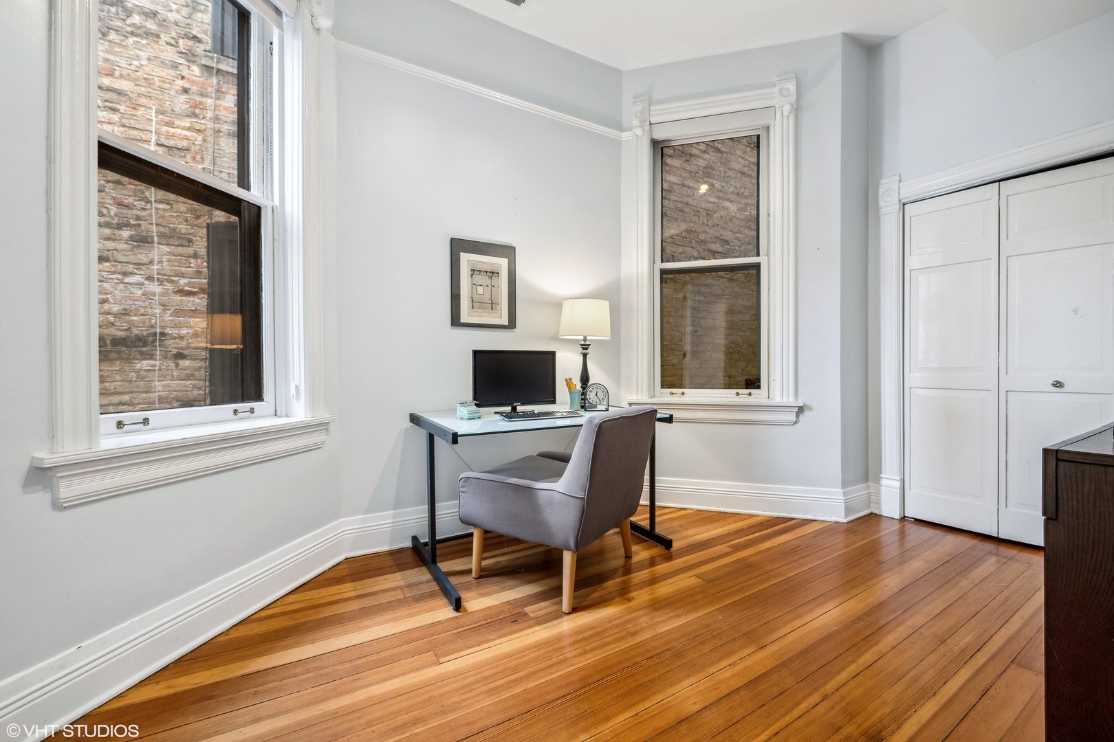626 West Belden Avenue, Unit 2 Chicago, IL 60614 - Photo 9 of 17 a workspace with wooden floor and a window