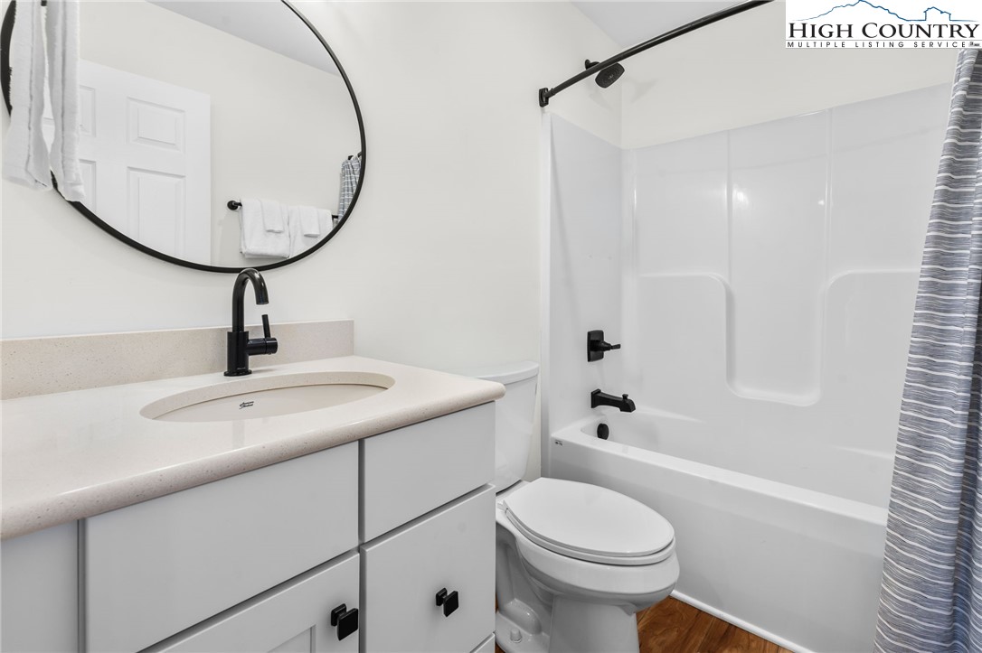 429 Townhomes Place, Unit 18 Boone, NC 28607 - Photo 16 of 25 a bathroom with a sink a toilet and shower