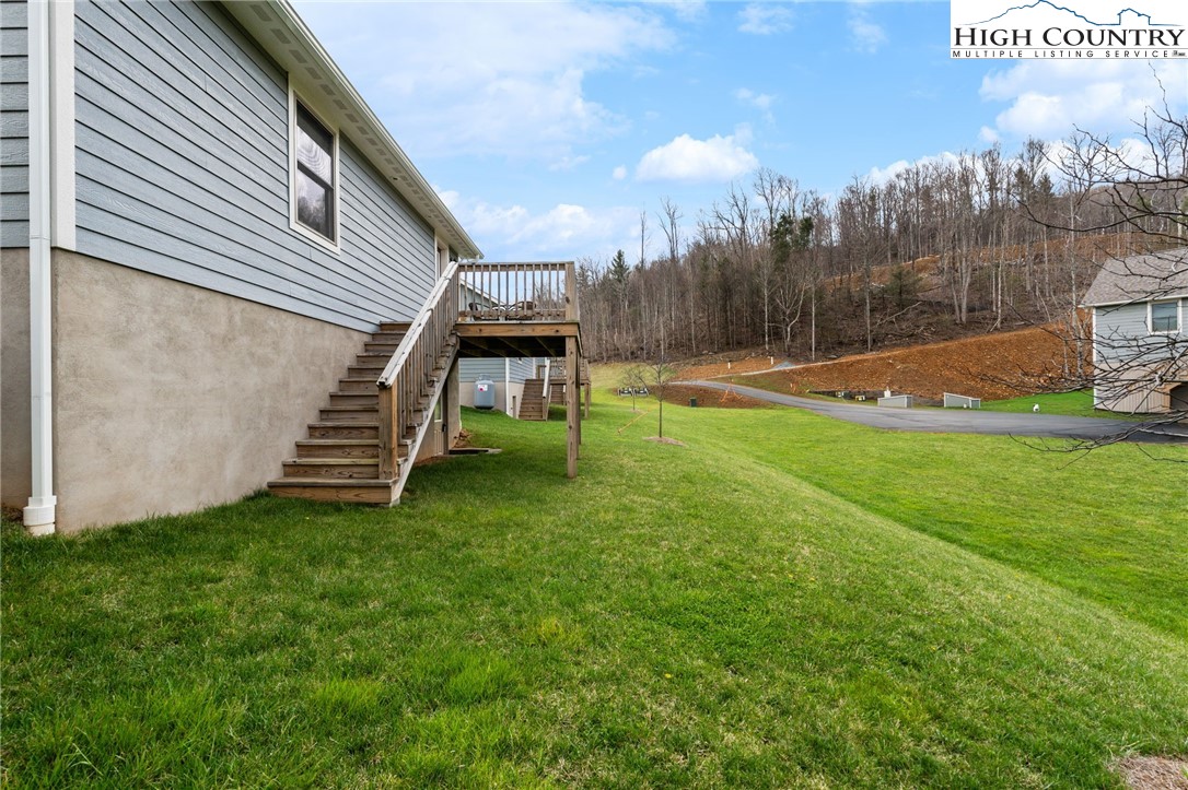 429 Townhomes Place, Unit 18 Boone, NC 28607 - Photo 22 of 25 a view of a backyard with sitting area