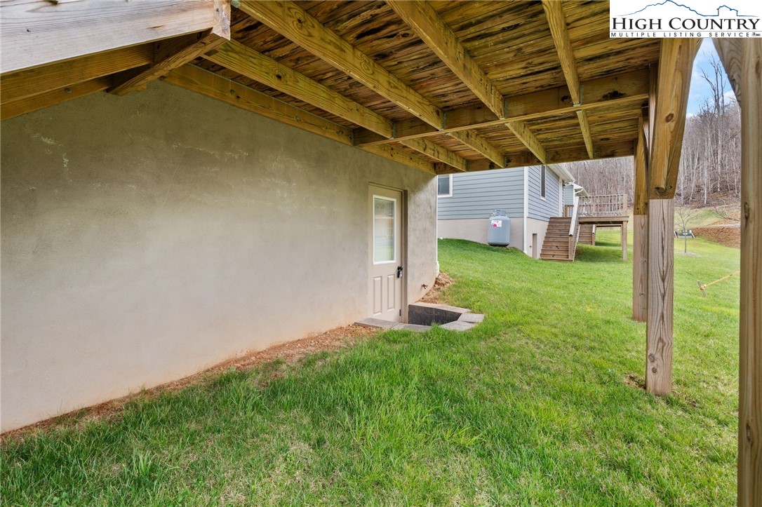 429 Townhomes Place, Unit 18 Boone, NC 28607 - Photo 23 of 25 a view of a backyard with a small cabin