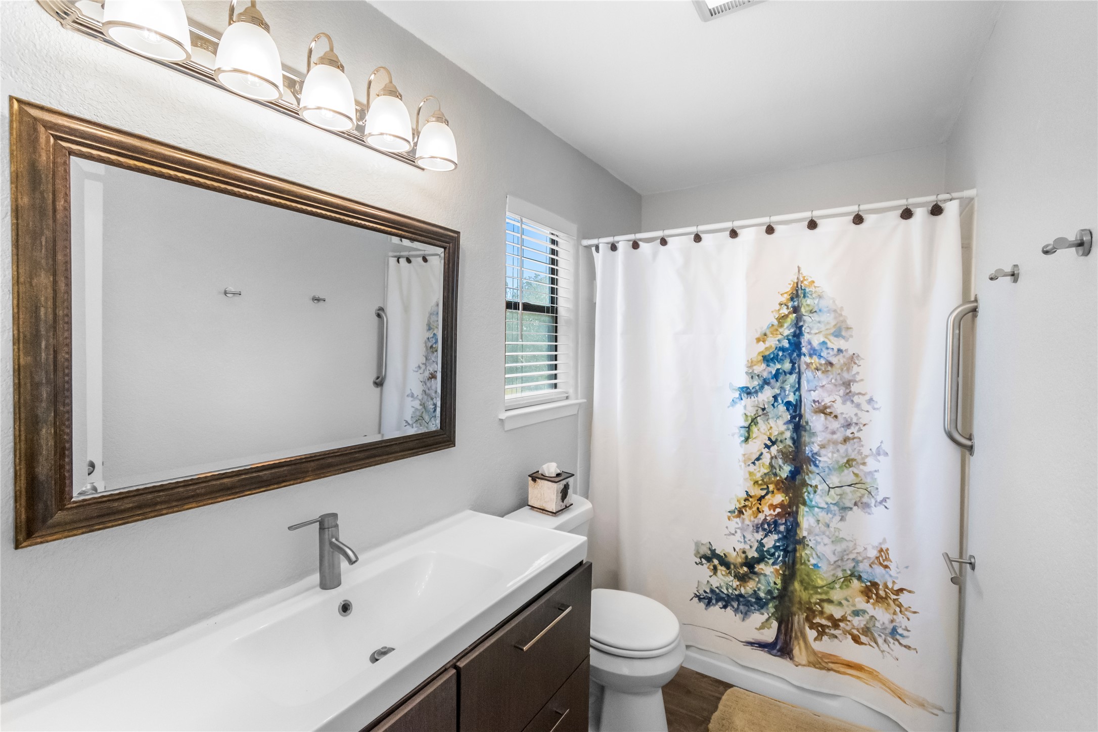 210 Teeoff, Unit B Horseshoe Bay, TX 78657 - Photo 20 of 38 Functional full bathroom featuring a modern vanity, spacious mirror, and shower/tub combo