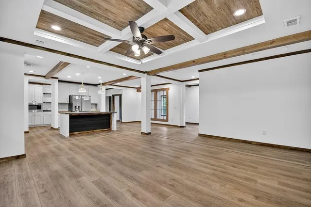 a view of a livingroom with fireplace and furniture