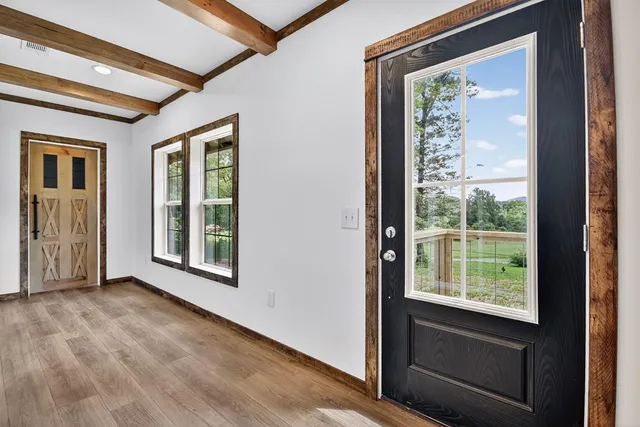 a view of an empty room with a window