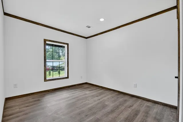 a white house that has a tree in front of it