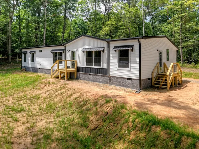 a house with trees in the background