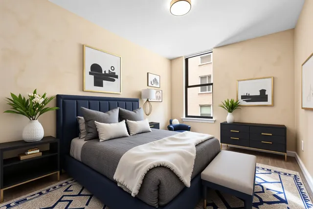 a bedroom with a bed table closet and window