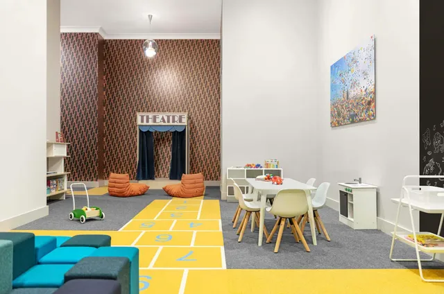 a dining room with a table and chairs