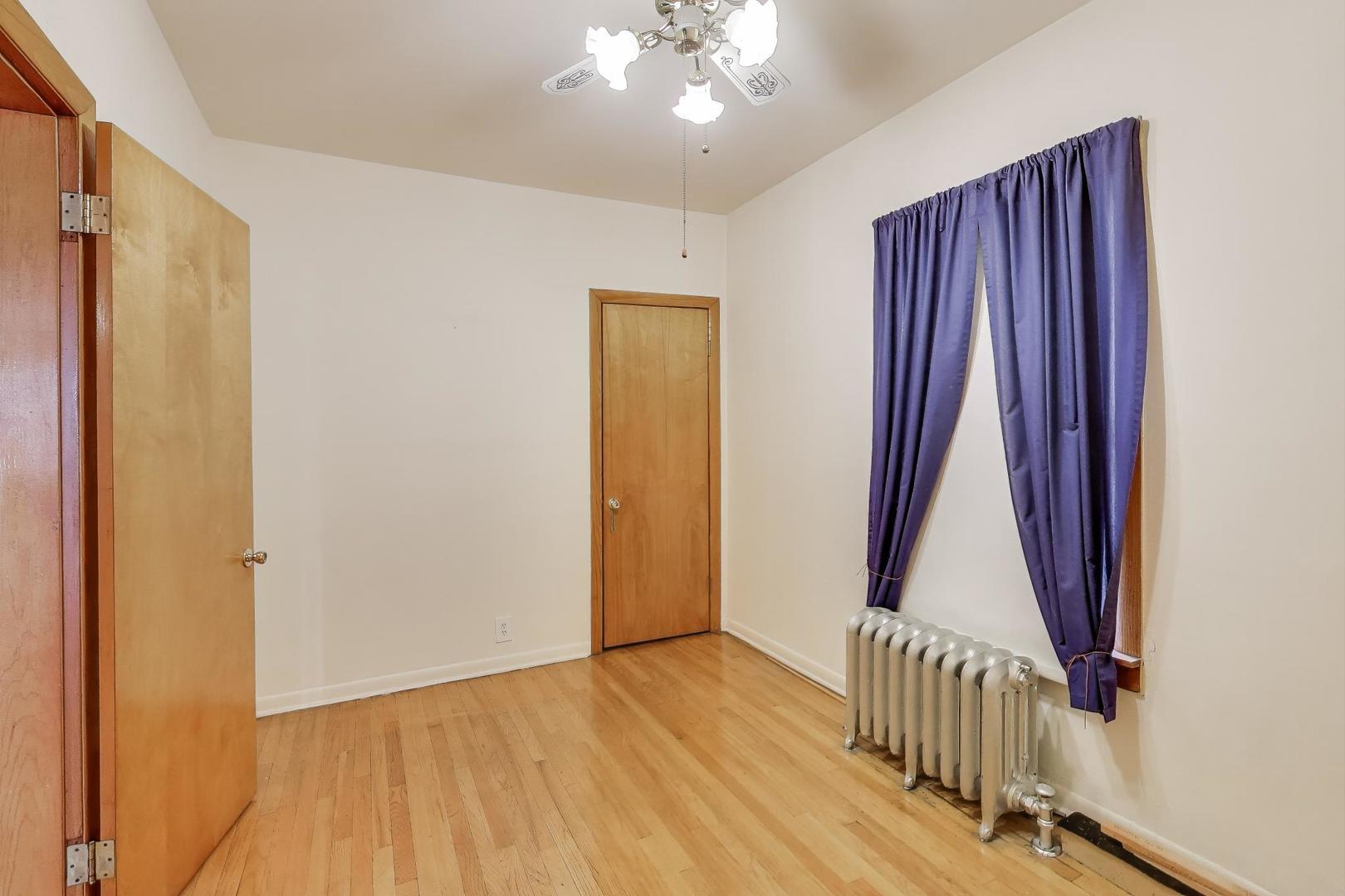 3958 South Rockwell Street Chicago, IL 60632 - Photo 12 of 38 a view of a room with a door and wooden floor