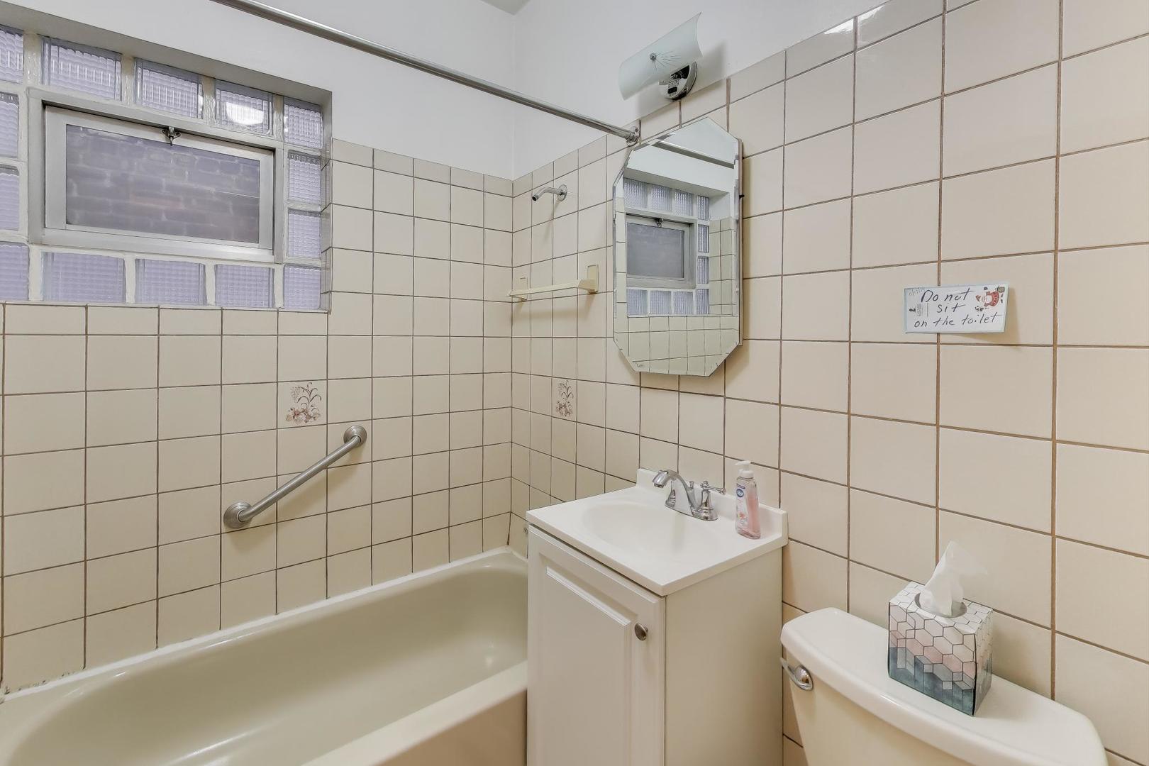 3958 South Rockwell Street Chicago, IL 60632 - Photo 17 of 38 a bathroom with a sink toilet and shower