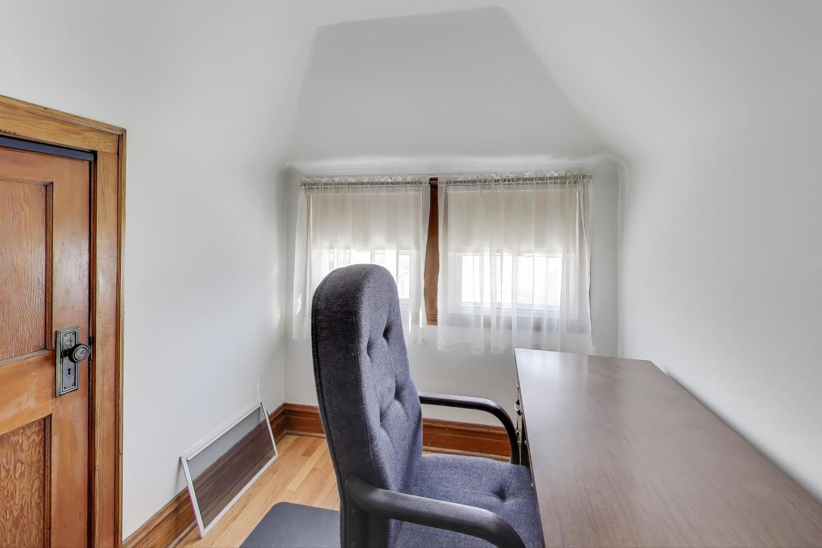 3958 South Rockwell Street Chicago, IL 60632 - Photo 20 of 38 a view of a hallway with furniture and a window