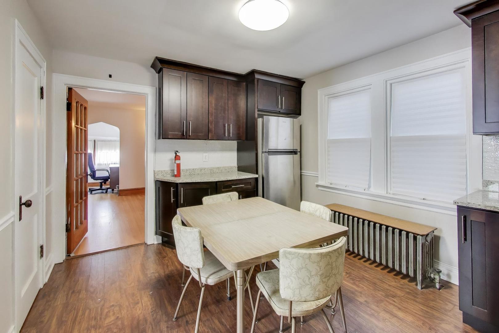3958 South Rockwell Street Chicago, IL 60632 - Photo 22 of 38 a view of a dining room with furniture and wooden floor
