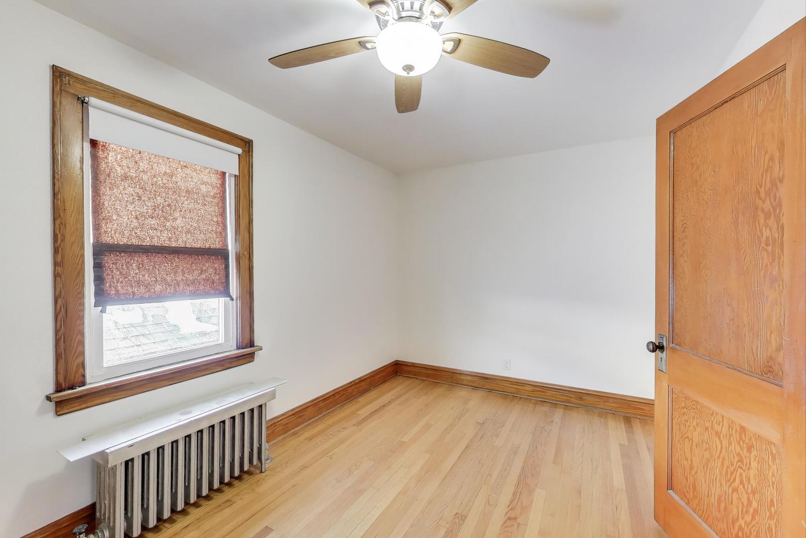 3958 South Rockwell Street Chicago, IL 60632 - Photo 24 of 38 a view of empty room with wooden floor and fan