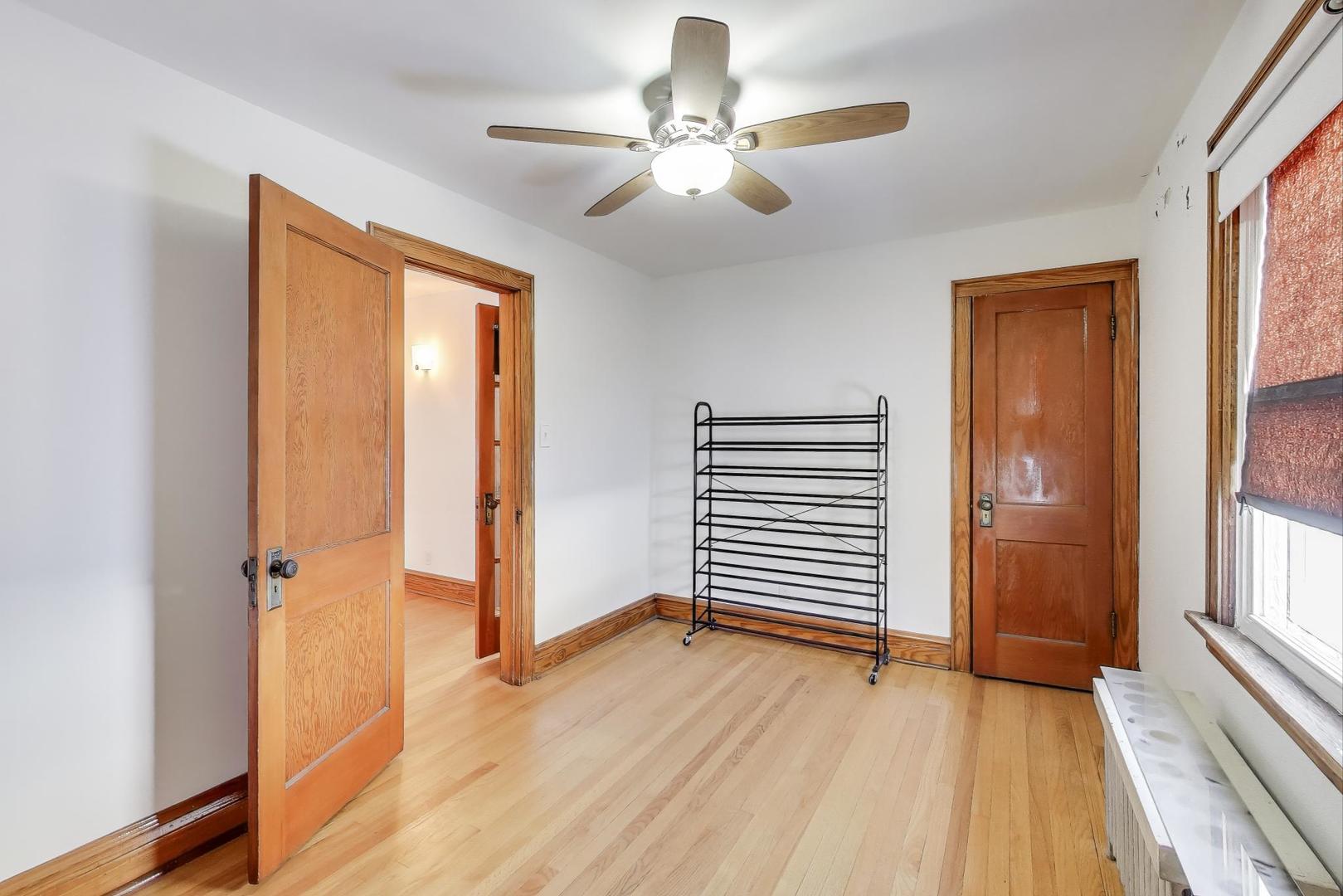 3958 South Rockwell Street Chicago, IL 60632 - Photo 25 of 38 wooden floor in an empty room with a window