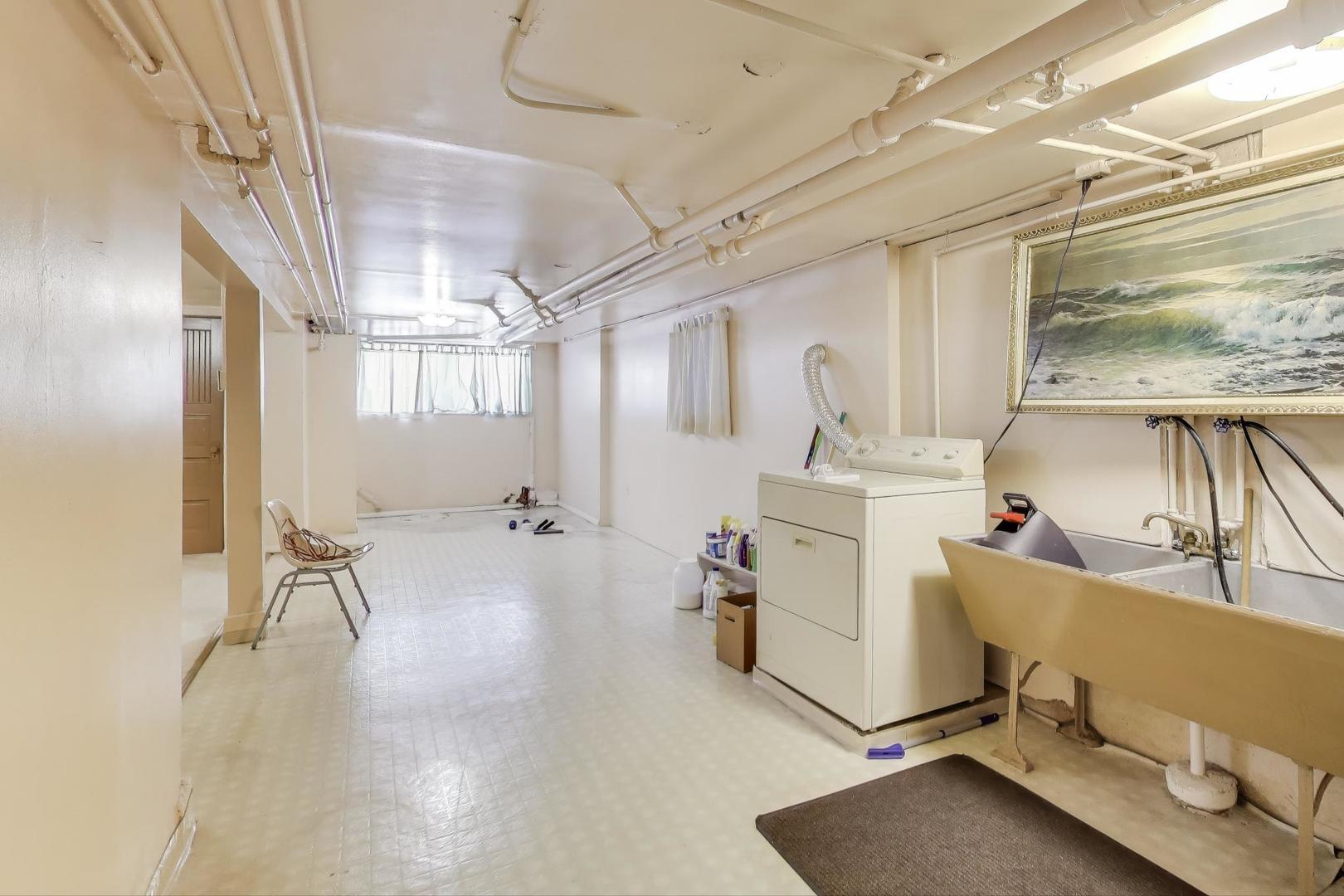 3958 South Rockwell Street Chicago, IL 60632 - Photo 29 of 38 a room with table chairs and wooden floor