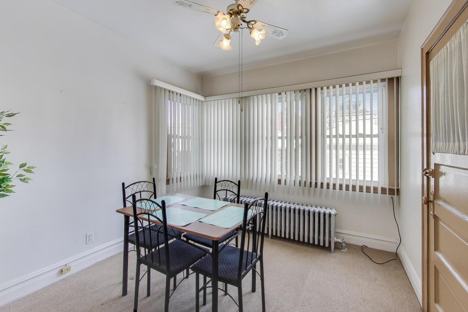 3958 South Rockwell Street Chicago, IL 60632 - Photo 9 of 38 a view of a dining room with furniture and chandelier