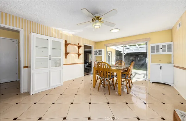a kitchen with a stove and a refrigerator