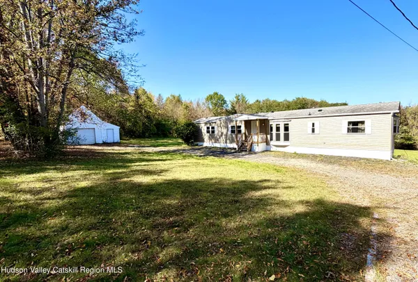 a view of a house with a big yard