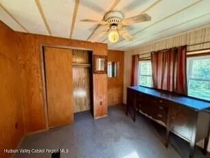 a view of room with window and cabinet