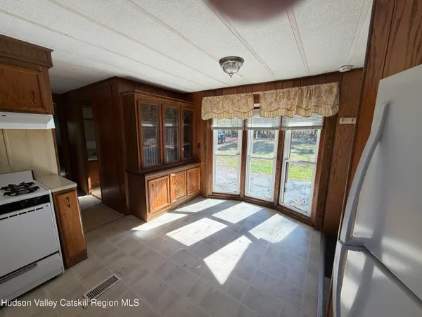 a view of an empty room and glass door