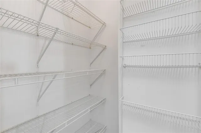 wooden floor and chandelier fan in a room