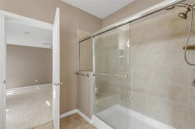 a bathroom with a granite countertop sink a toilet and a mirror