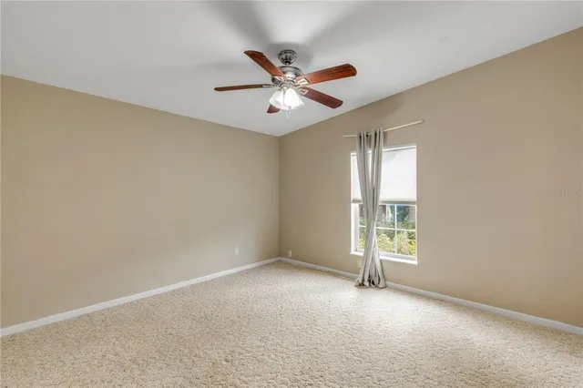 a view of an empty room and window