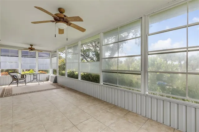 an aerial view of a houses with a street