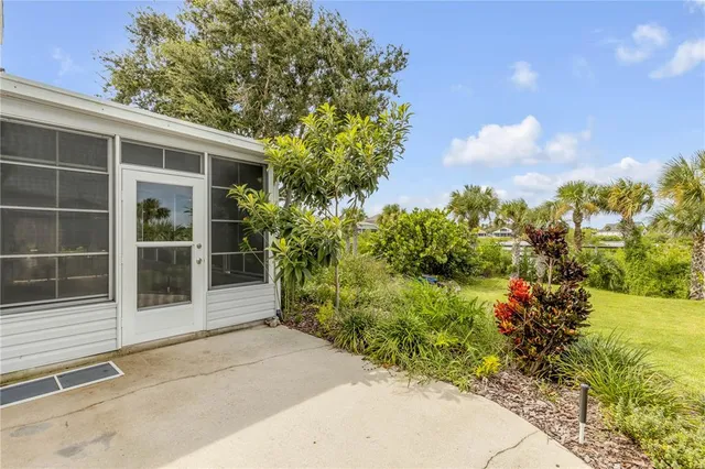 an aerial view of a house with a lake view
