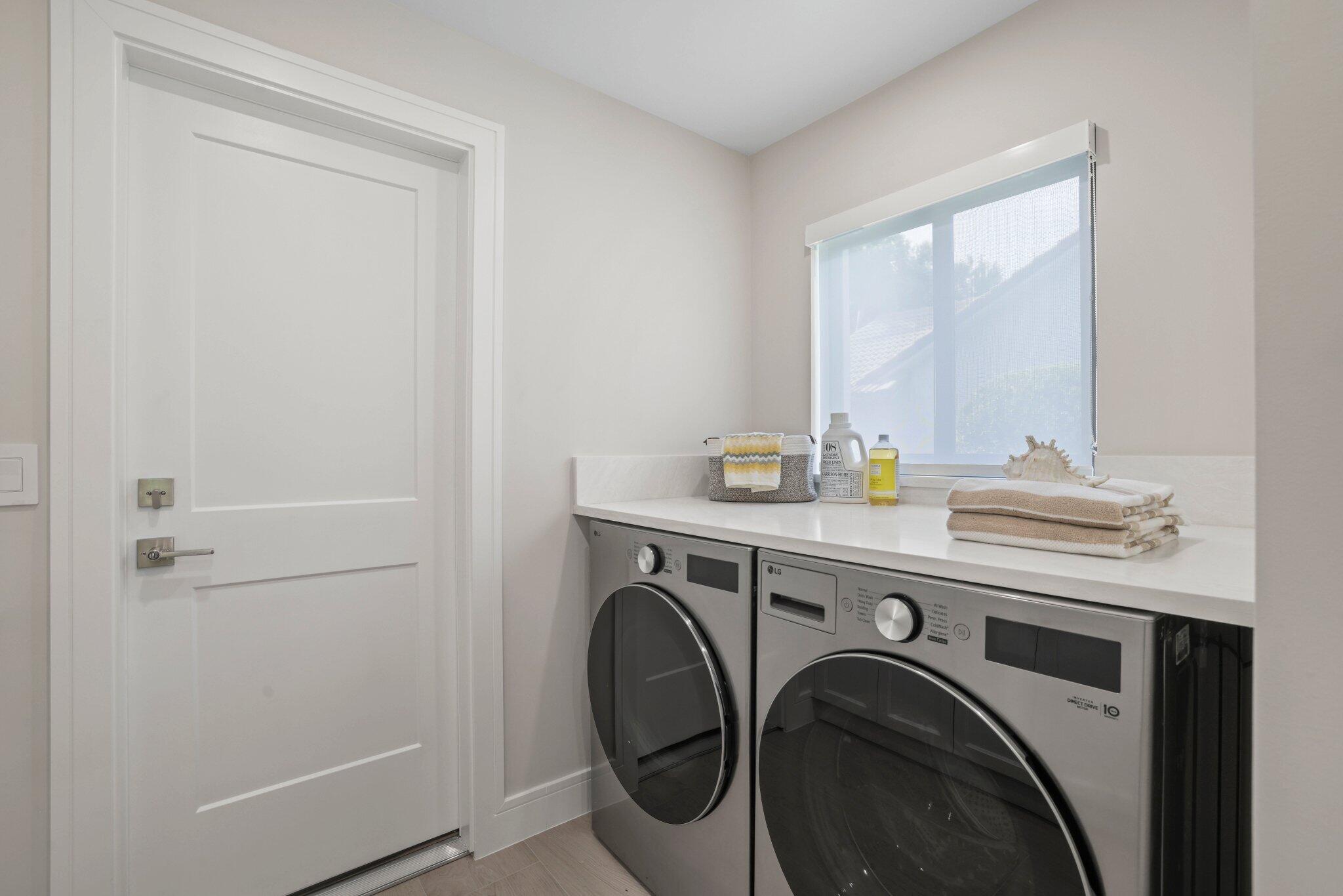 3901 Northwest 27th Avenue Boca Raton, FL 33434 - Photo 28 of 56 a utility room with dryer and washer