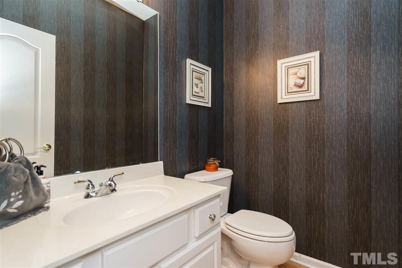 5409 Brandy Bay Road Raleigh, NC 27613 - Photo 11 of 25 a bathroom with a sink and a toilet