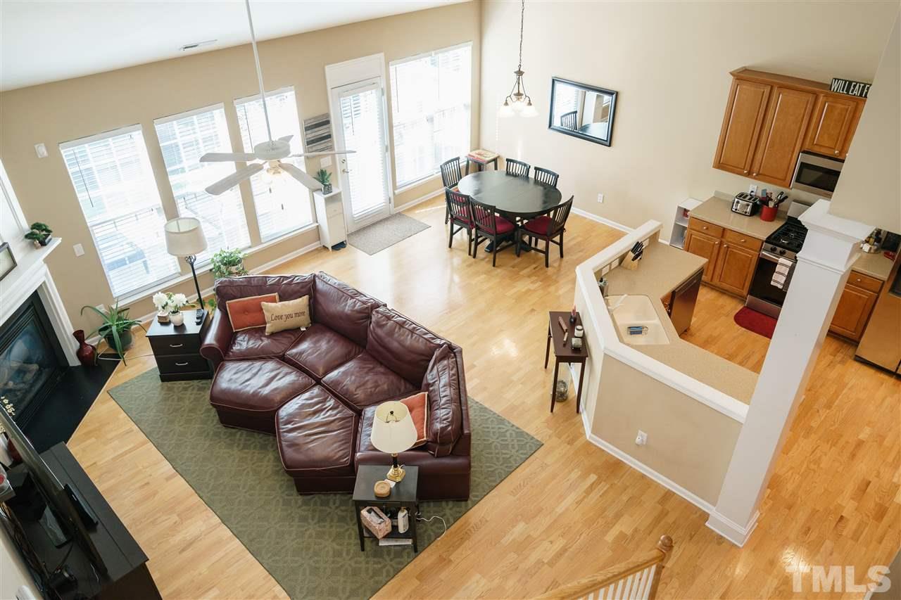 5409 Brandy Bay Road Raleigh, NC 27613 - Photo 15 of 25 a living room with furniture a flat screen tv and a large window