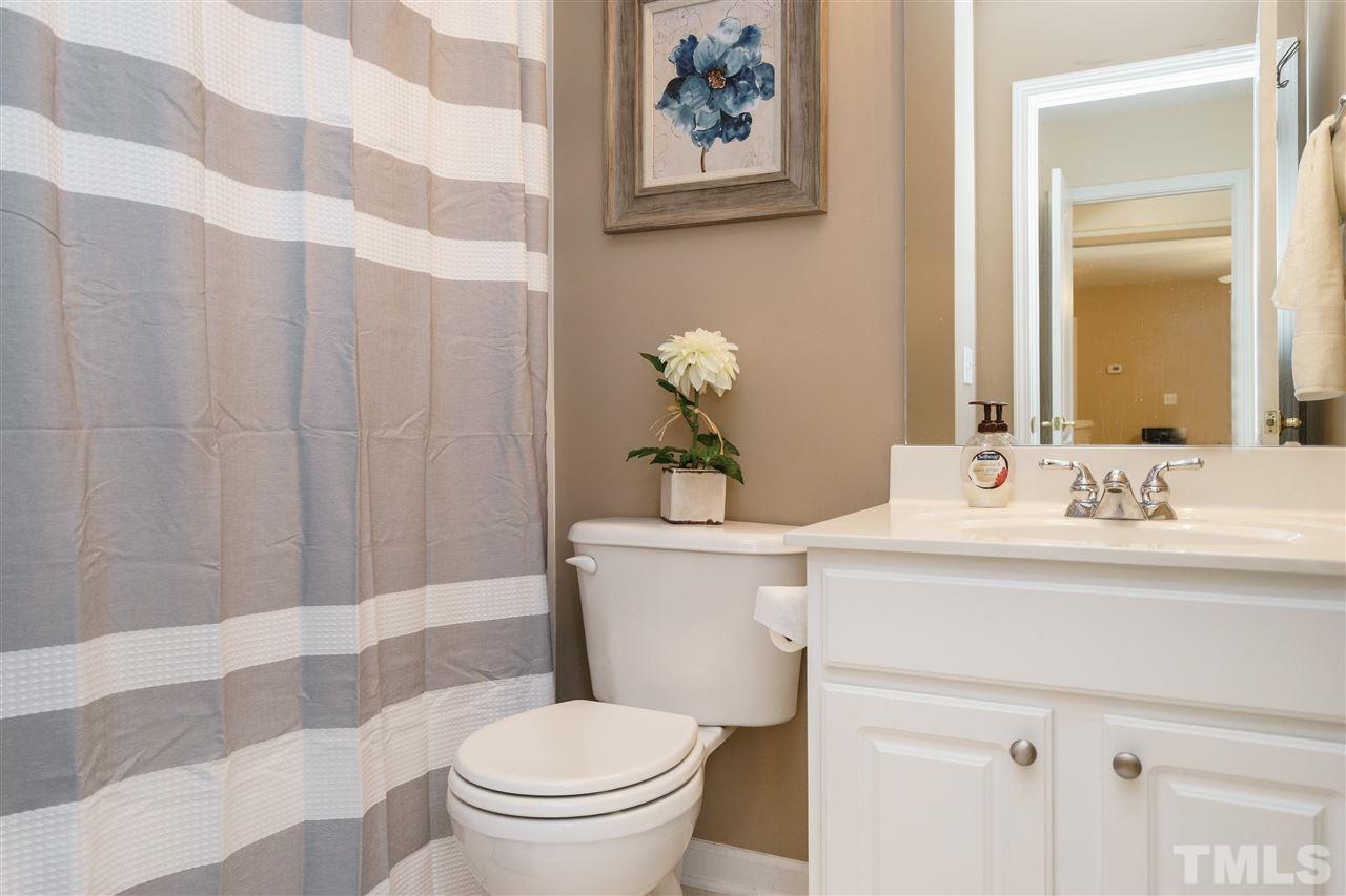 5409 Brandy Bay Road Raleigh, NC 27613 - Photo 21 of 25 a bathroom with a sink toilet and shower