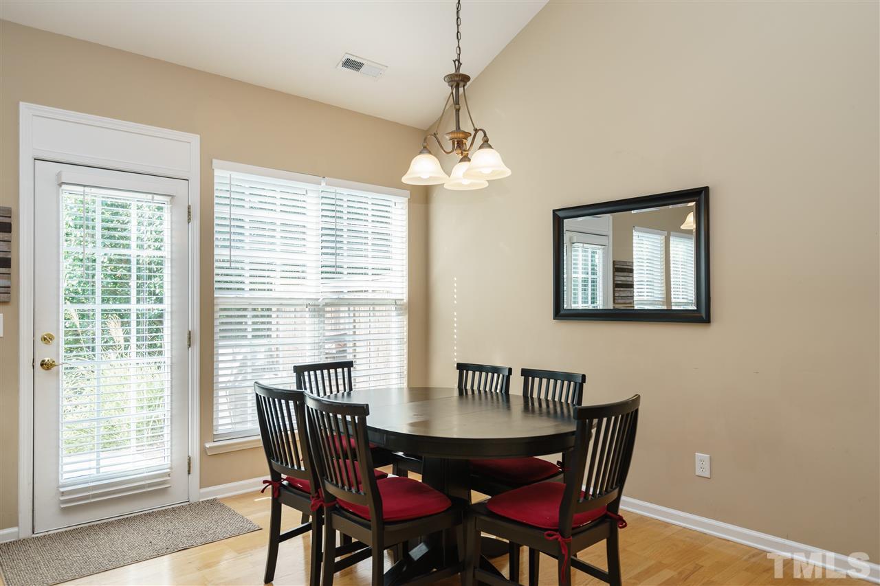 5409 Brandy Bay Road Raleigh, NC 27613 - Photo 6 of 25 a view of a dining room with furniture window and outside view