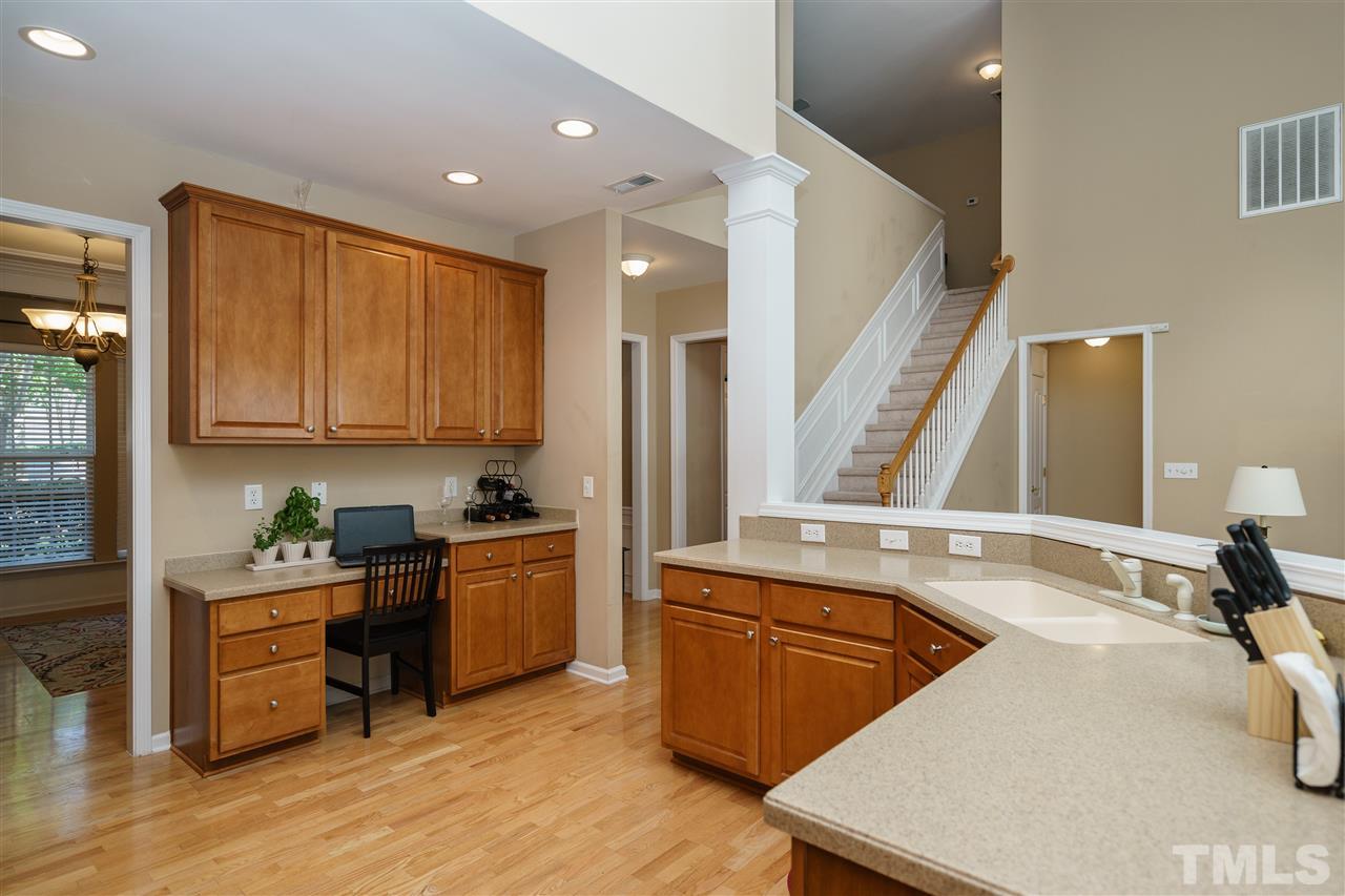 5409 Brandy Bay Road Raleigh, NC 27613 - Photo 9 of 25 a kitchen with a sink stove and cabinets