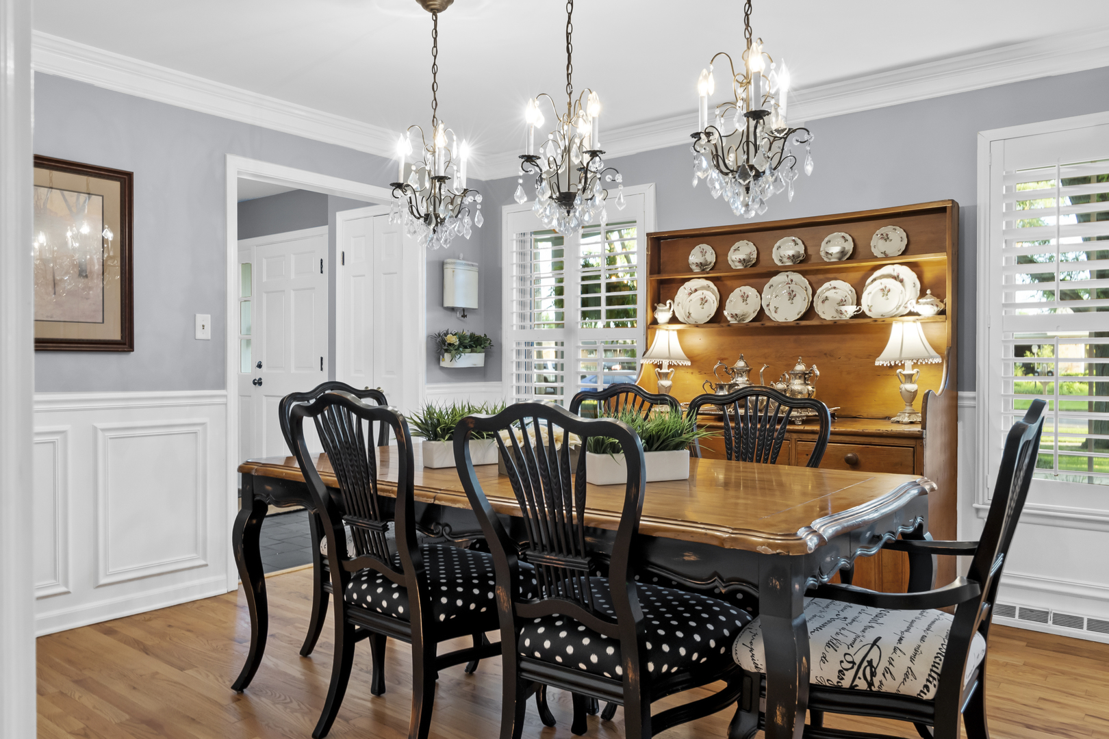 1713 East Thomas Road Wheaton, IL 60187 - Photo 12 of 55 a view of a dining room with furniture a chandelier and wooden floor