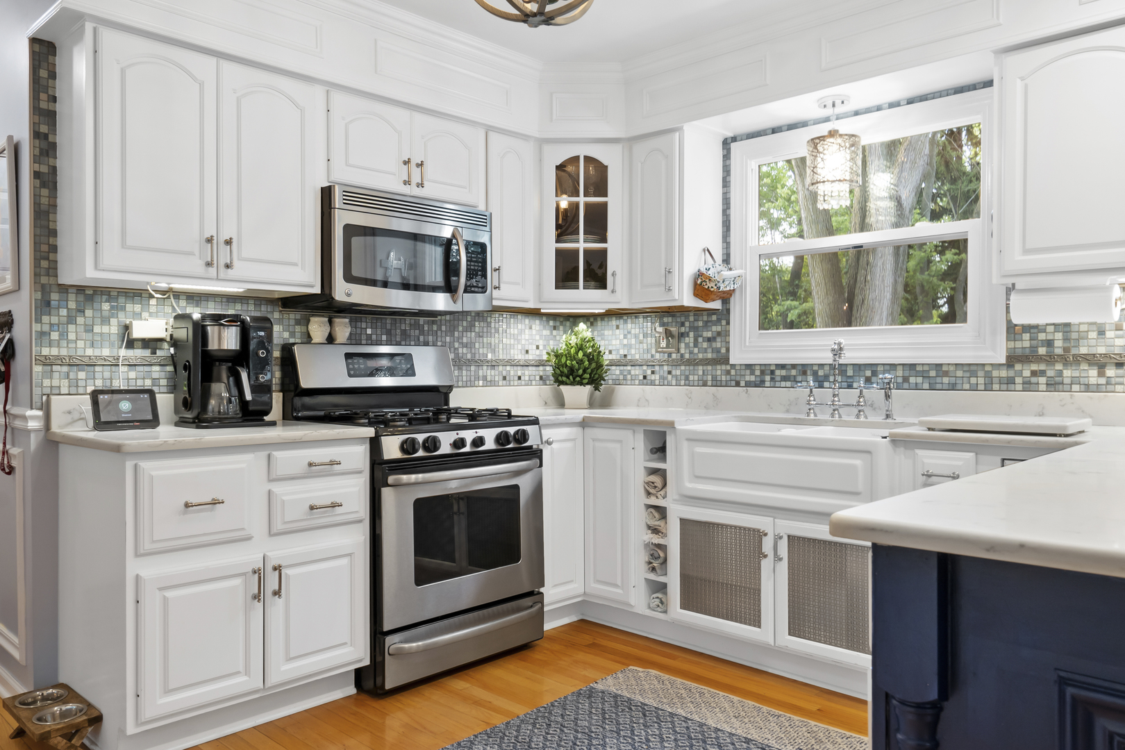 1713 East Thomas Road Wheaton, IL 60187 - Photo 16 of 55 a kitchen with stainless steel appliances granite countertop a stove a sink and a microwave