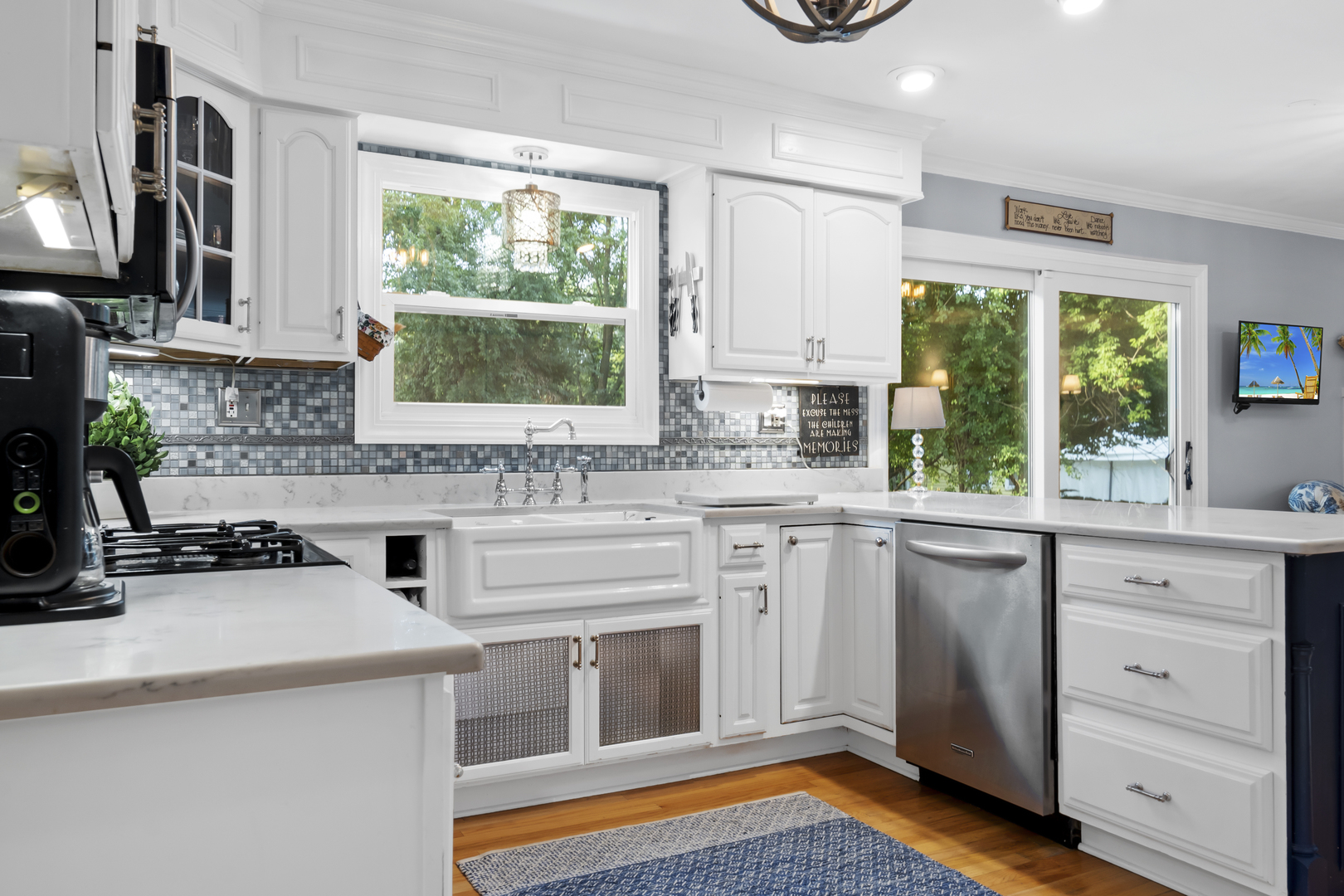 1713 East Thomas Road Wheaton, IL 60187 - Photo 17 of 55 a kitchen with a stove a sink and a microwave