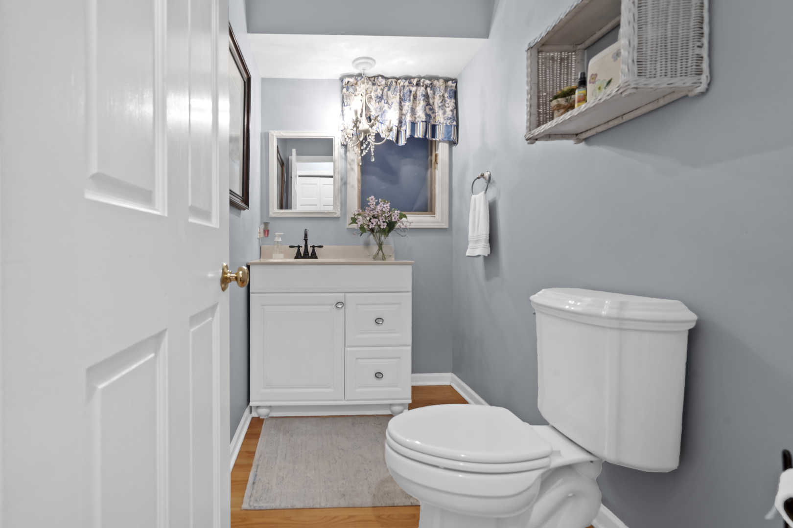 1713 East Thomas Road Wheaton, IL 60187 - Photo 25 of 55 a bathroom with a sink a toilet a mirror and vanity