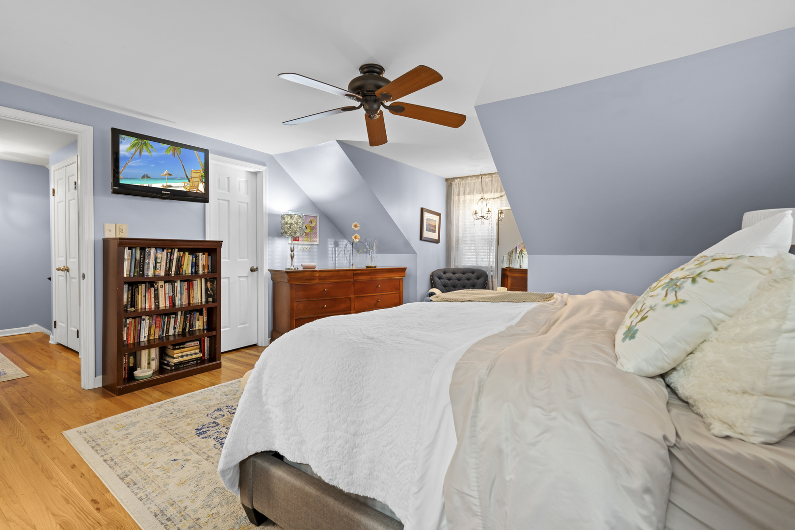 1713 East Thomas Road Wheaton, IL 60187 - Photo 27 of 55 a bedroom with a bed a dresser and book shelf
